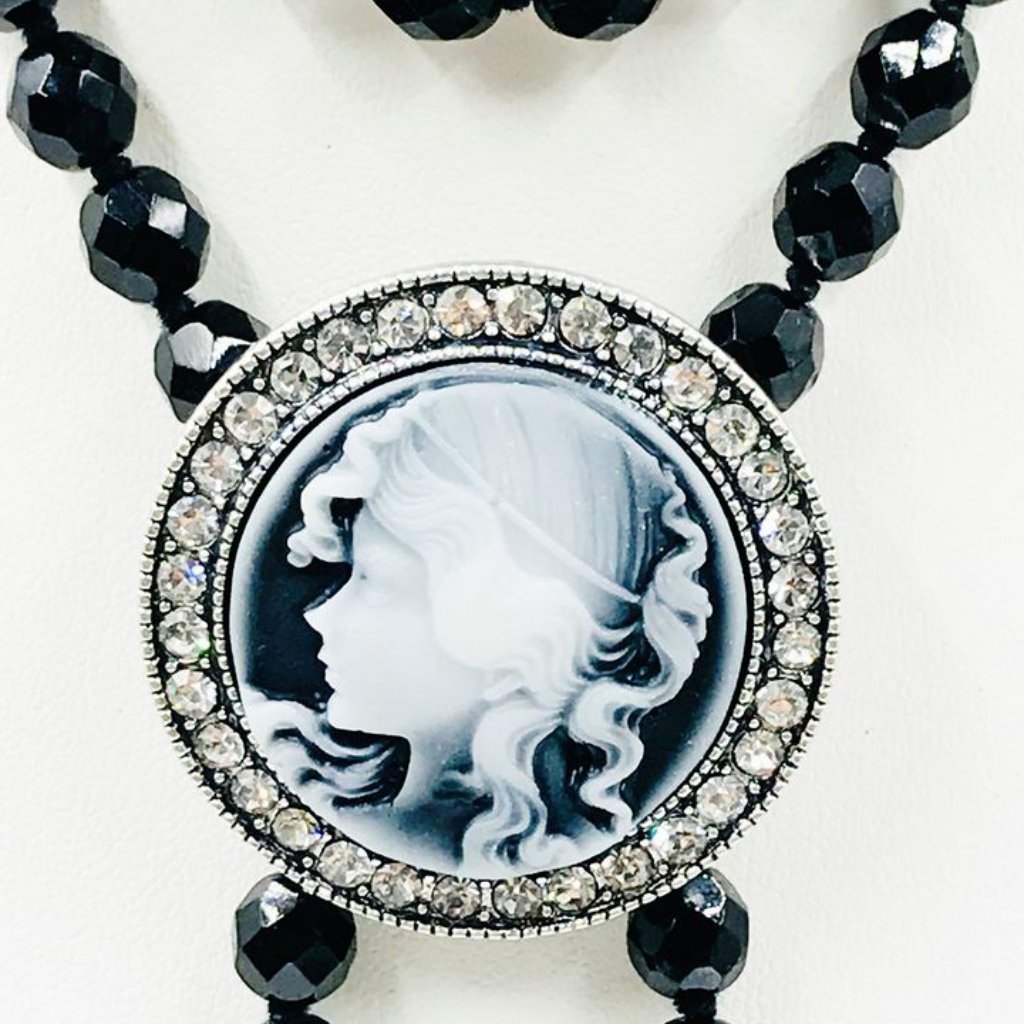 Gray Round Cameo Brooch With Clear Crystal Glass Rhinestone Perimeter.
